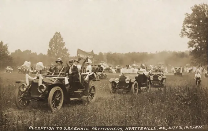 Congressional Union for Woman Suffrage driving through fields from, Hyattsville, MD, to deliver their petitions to the U.S. Senate in Washington, D.C. July 31, 1913