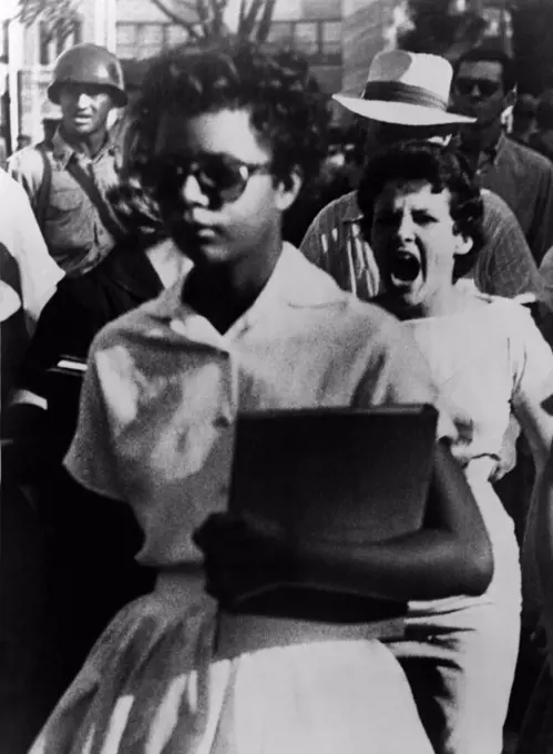Elizabeth Eckford, one of the nine African American students enrolled in Little Rock Central High is harassed on the first day of school on Sept 6, 1957. Arkansas National Guards were ineffective in controlling racist crowds and were replaced by Federal troops on September 24.