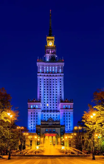 Warsaw, Poland - May 11, 2021: Night view of Culture and Science Palace, Palac Kultury i Nauki, tower and park in Srodmiescie city center district