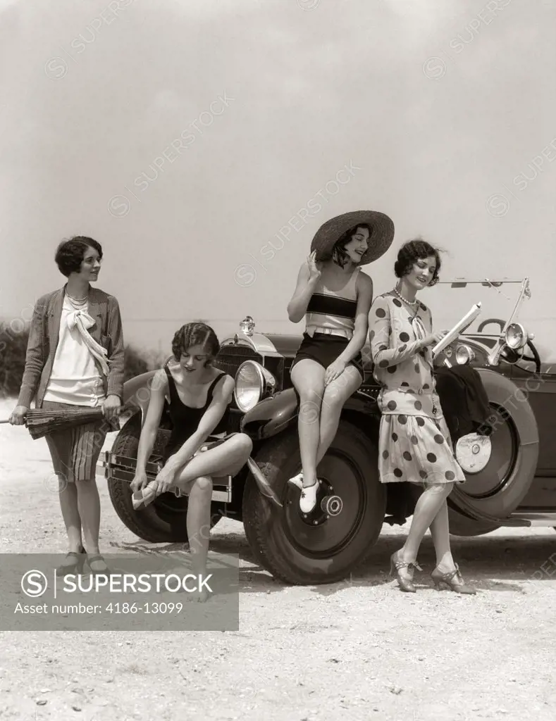 1920S Group Of Four Women At Shore Gathered Around Convertible Two In Dresses & Two In Bathing Suits