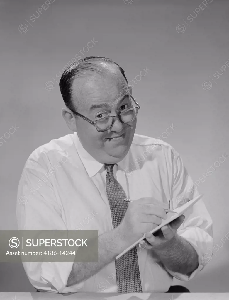 1950S 1960S Balding Businessman Wearing Eyeglasses Shirt Sleeves Smiling Writing Notepad