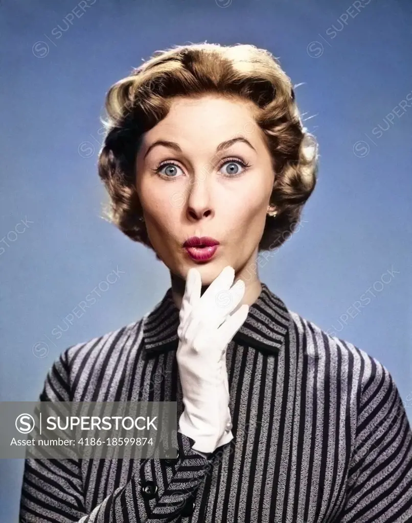 1960s 1950s PORTRAIT WOMAN WHITE GLOVE HAND TO CHIN SHOCKED SURPRISED EXPRESSION LOOKING AT CAMERA