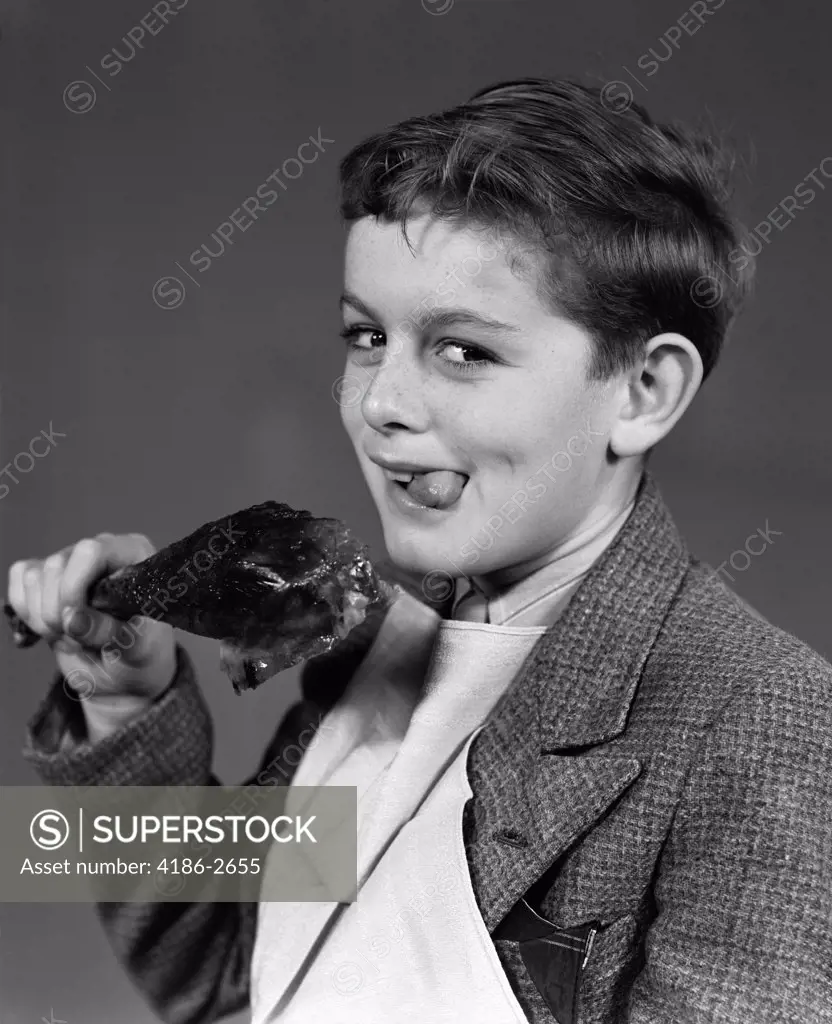 1940S Portrait Of Boy With Napkin Bib And Turkey Leg Smiling At Camera