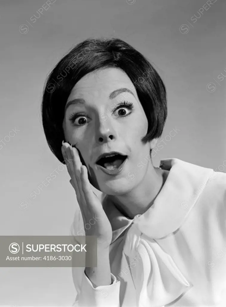 1960S Brunette Woman Mouth Agape Eyes Wide Hand To Cheek Funny Face Expression Shock Surprise Anger Amazed