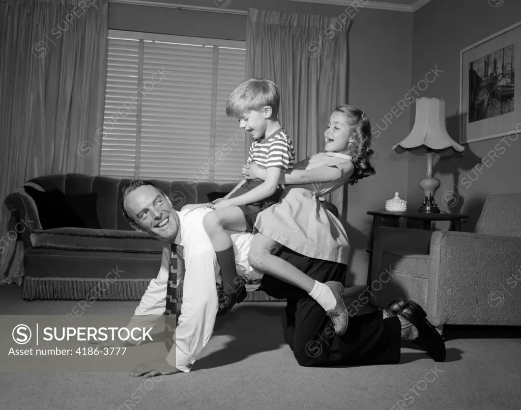 1950S Dad Carrying Boy & Girl Piggyback