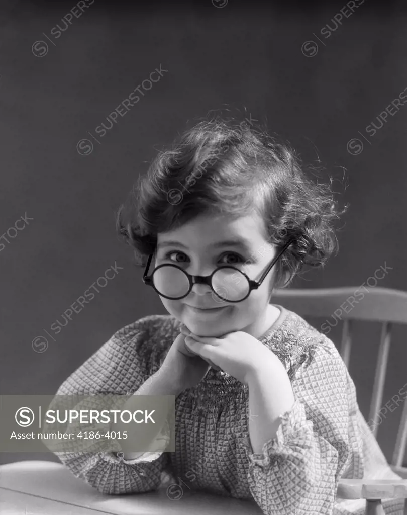 1930S Portrait Little Girl Smiling Wearing Big Round Eyeglasses  