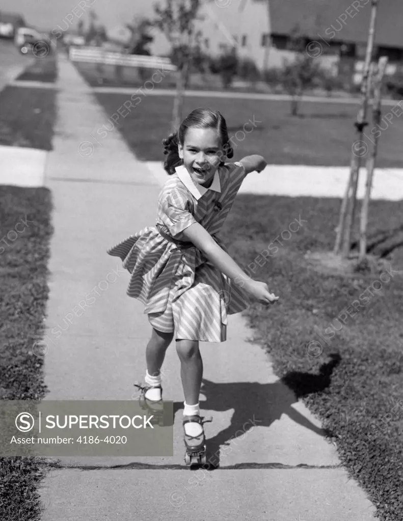 1950S Little Girl Roller-Skating On Sidewalk