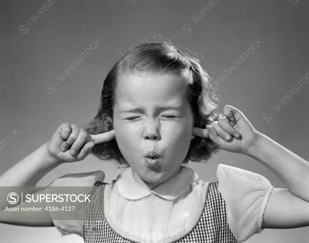 1950S Girl With Fingers In Ears Eyes Closed Hearing Noise