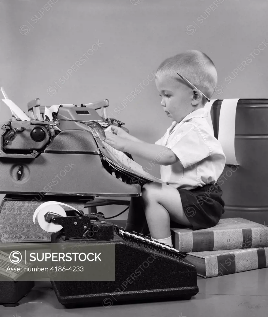 1950S Child Typing Sitting At Typewriter