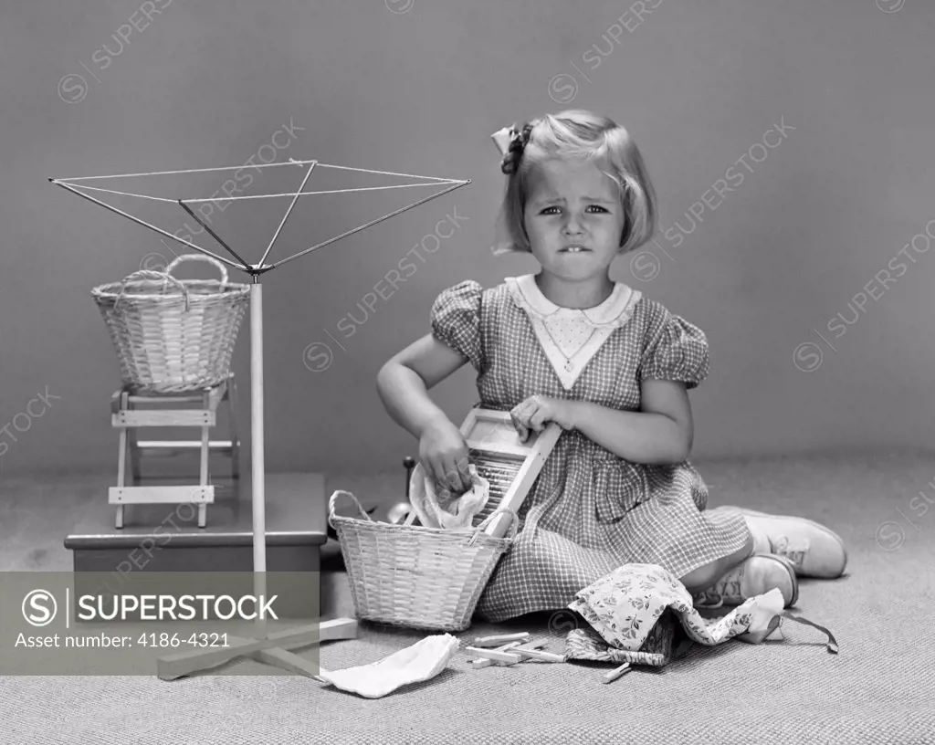 1940S Unhappy Little Blond Girl Playing With Child Size Wash Day Toys