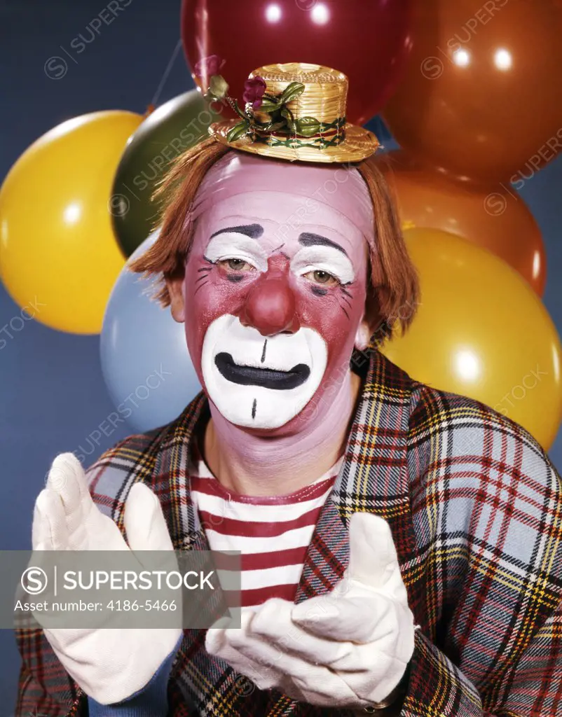 1960S Portrait Of Clown With A Sad Expression Wearing Tiny Hat Clapping His Hands