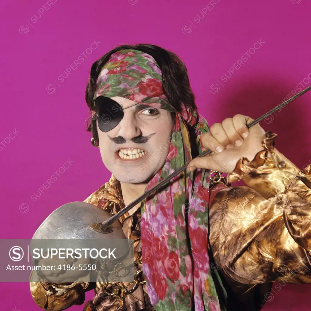 1970S Character Man Swashbuckler In Pirate Costume Holding A Sword Funny Face Expression Moustache Gritting Teeth