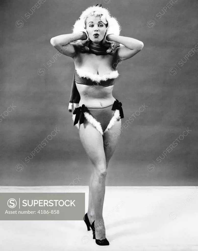 1950S Young Woman Standing Inside Wearing Fur Trimmed Bikini And Gloves