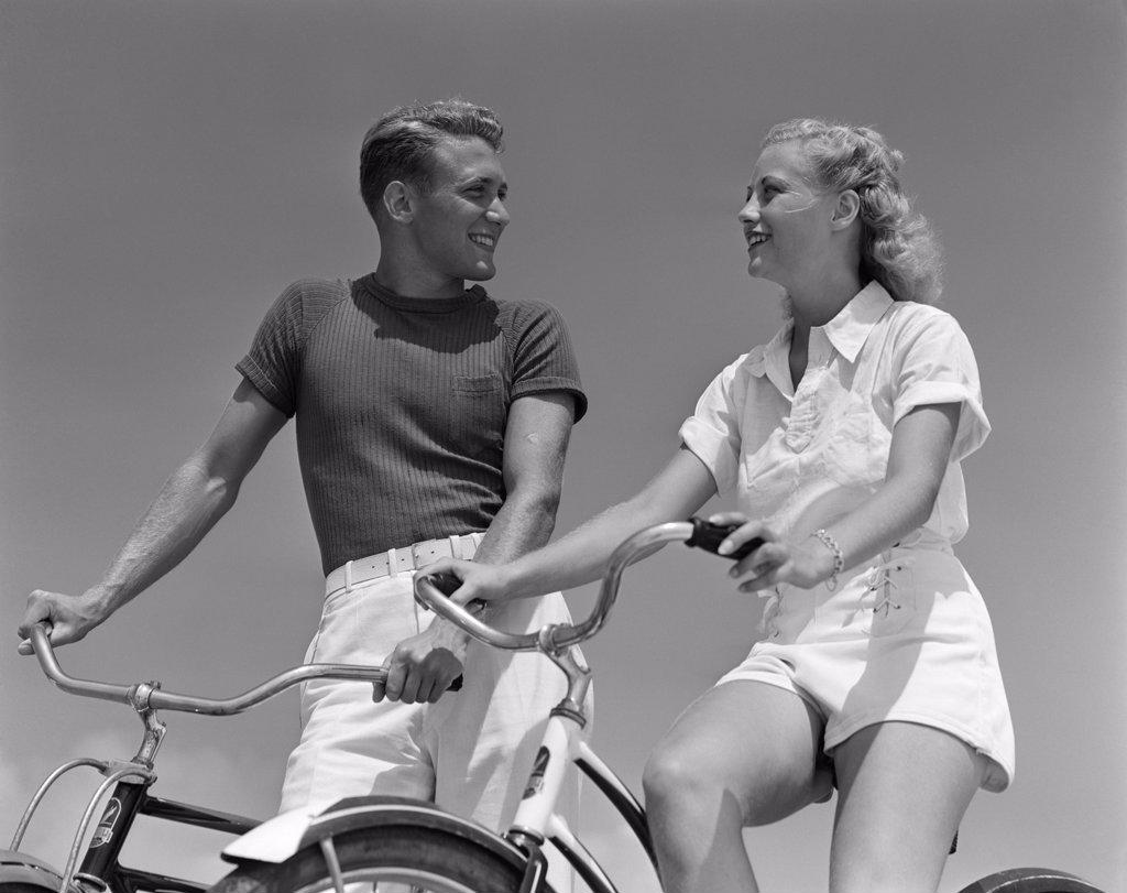 1940S Smiling Blond Couple On Bikes