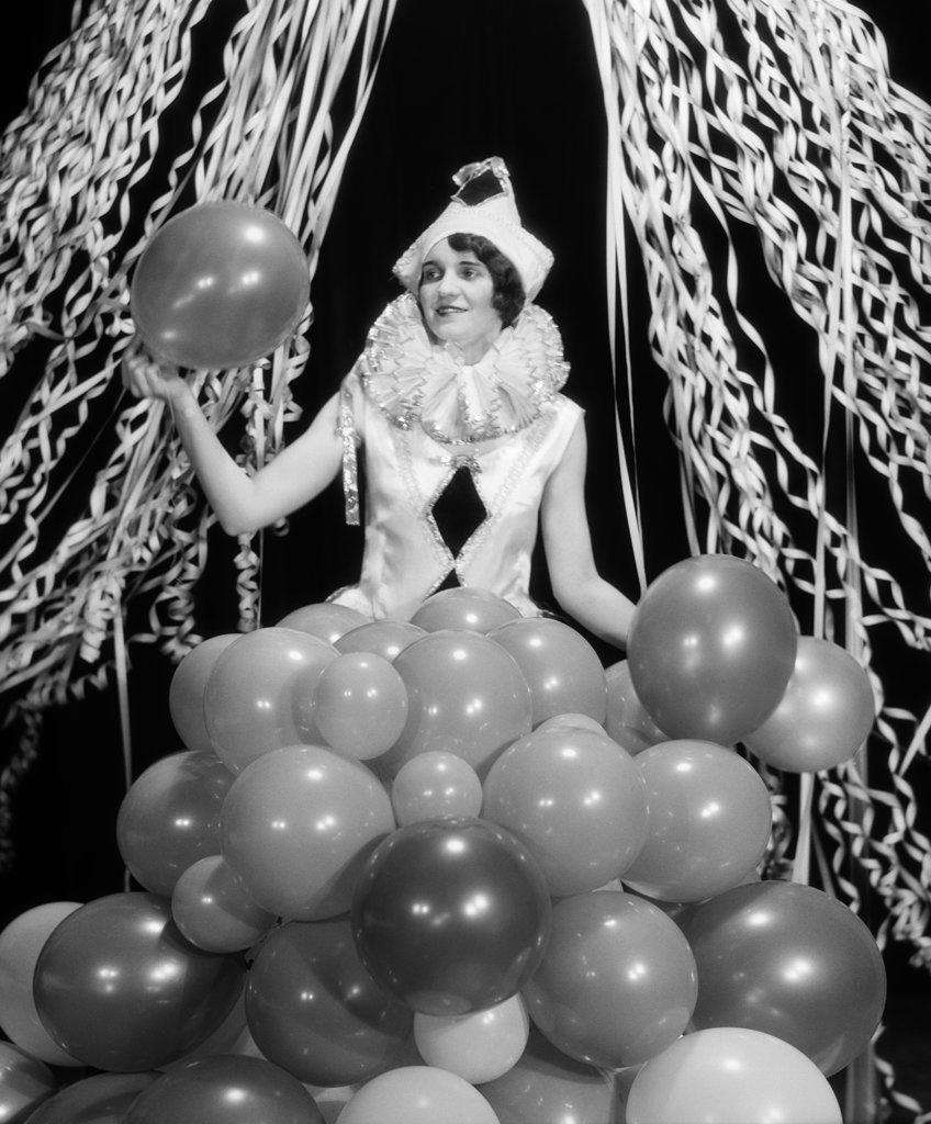 1920S 1930S Smiling Young Woman Pierrot Clown Amid Party Balloons And Paper Streamers