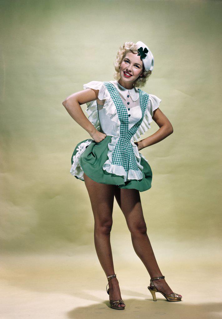 1940S 1950S Portrait Smiling Blond Woman Pinup Wearing Green Checked Waitress Uniform And Hat With Shamrock Looking At Camera Stock Photo 4186-14007 : Superstock