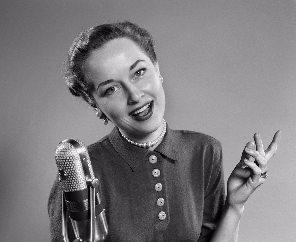 1950S Portrait Of Woman Singing Or Speaking At Microphone Radio Broadcast Indoor