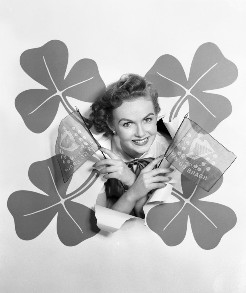 1950S Smiling Woman Head Through Backdrop Surrounded By 4 Shamrocks Holding Erin Go Bragh Flags Irish Holiday St. Paddy'S Day
