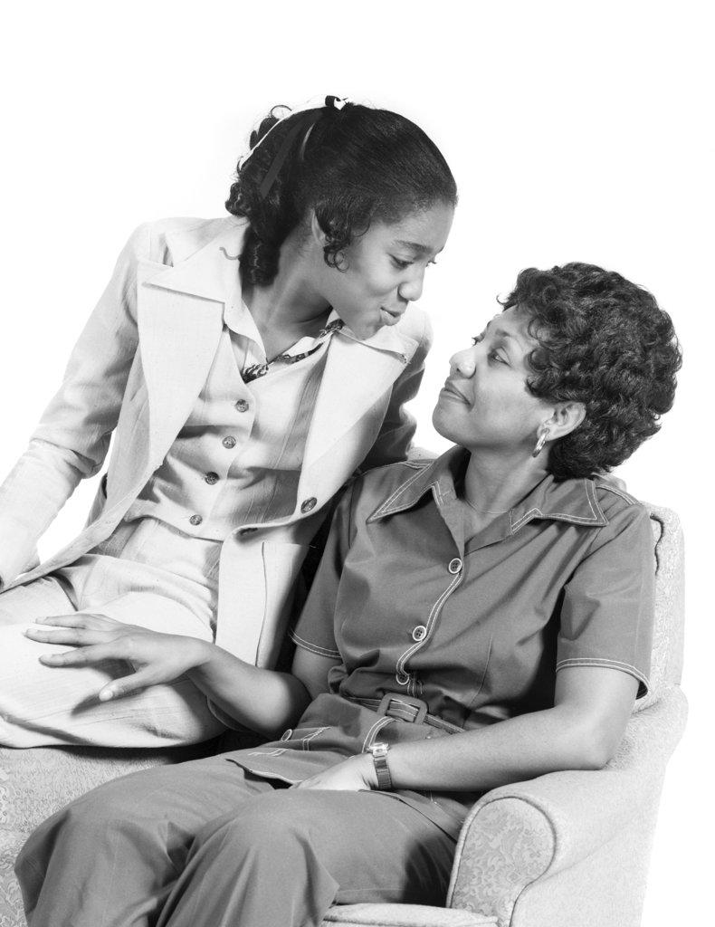 1970s AFRICAN-AMERICAN MOTHER DAUGHTER SMILING AT EACH OTHER PORTRAIT 