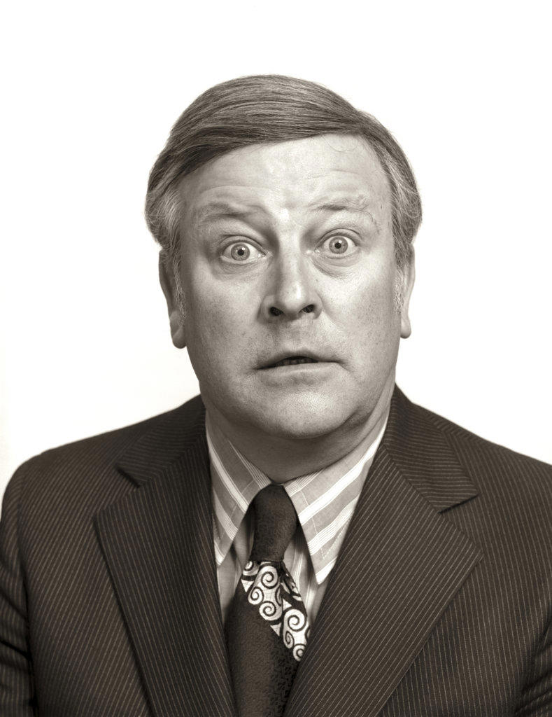 1970s PORTRAIT WIDE EYE BUSINESS MAN FUNNY FACE SHOWING FACIAL EXPRESSION SHOCK SURPRISE STARE FEAR AMAZEMENT WONDER