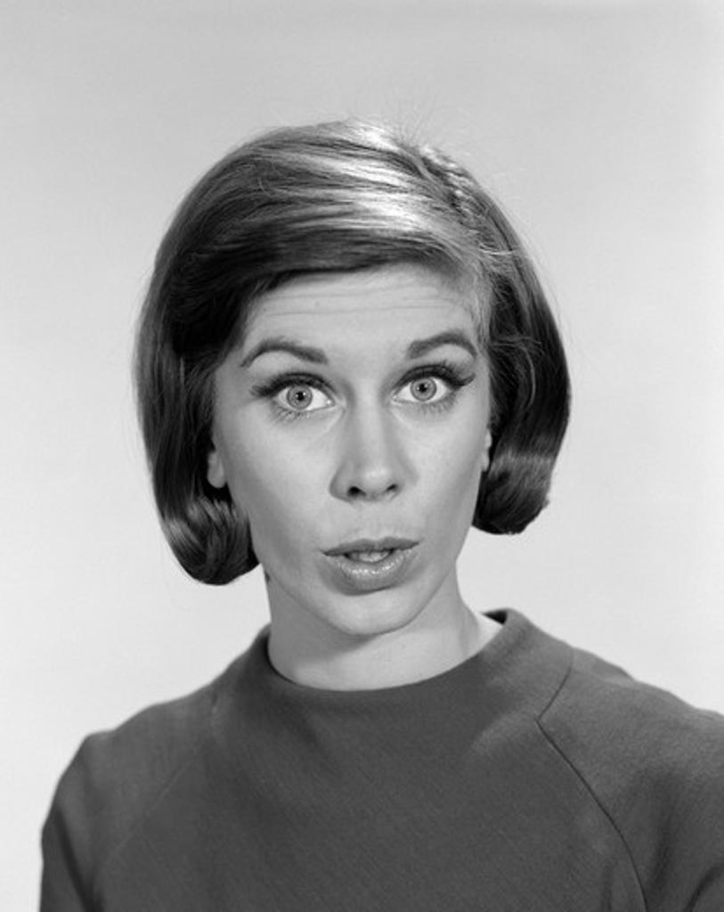 1960S Woman Portrait Look Direct At The Camera Asking Question Wonder Puzzled Funny Face Expression Spokesperson
