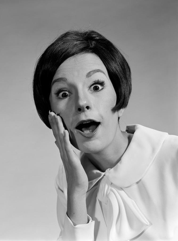 1960S Brunette Woman Mouth Agape Eyes Wide Hand To Cheek Funny Face Expression Shock Surprise Anger Amazed