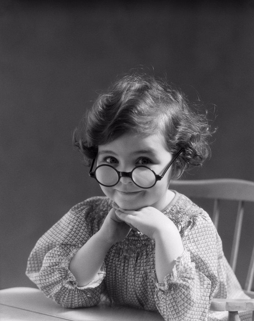 1930S Portrait Little Girl Smiling Wearing Big Round Eyeglasses  
