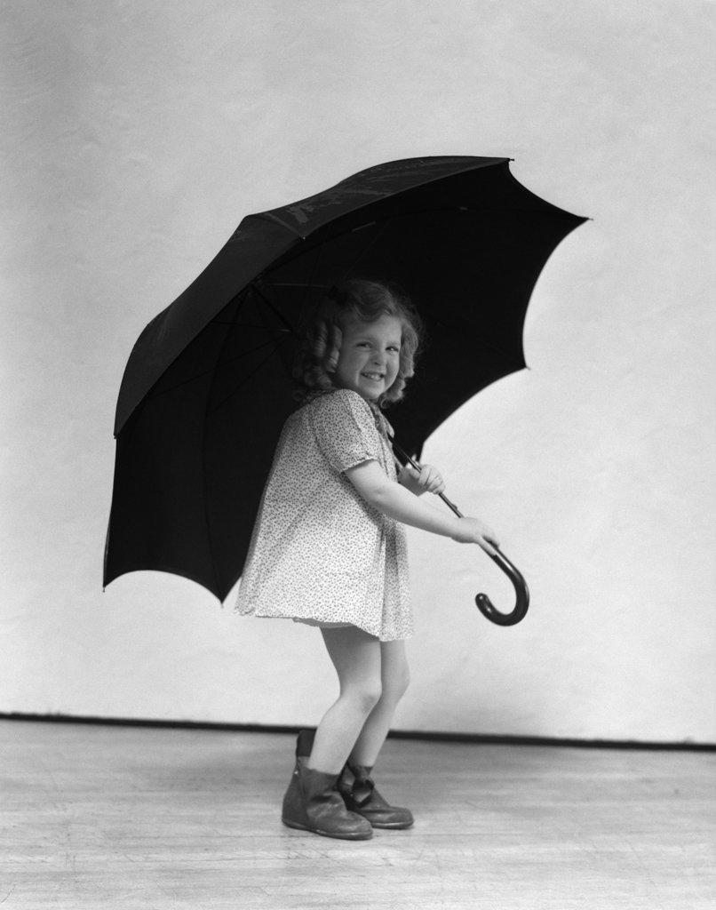 1930S Child Smiling Laughing Little Girl With Curly Ringlets Holding Large Adult Size Umbrella