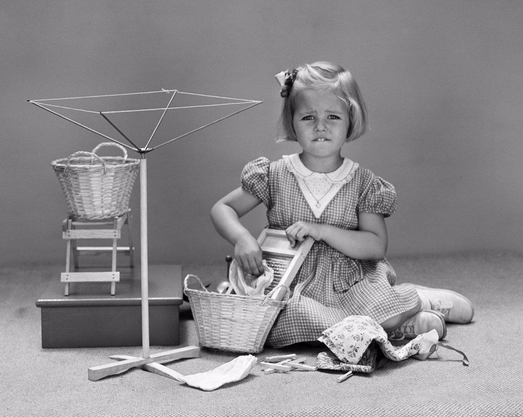 1940S Unhappy Little Blond Girl Playing With Child Size Wash Day Toys