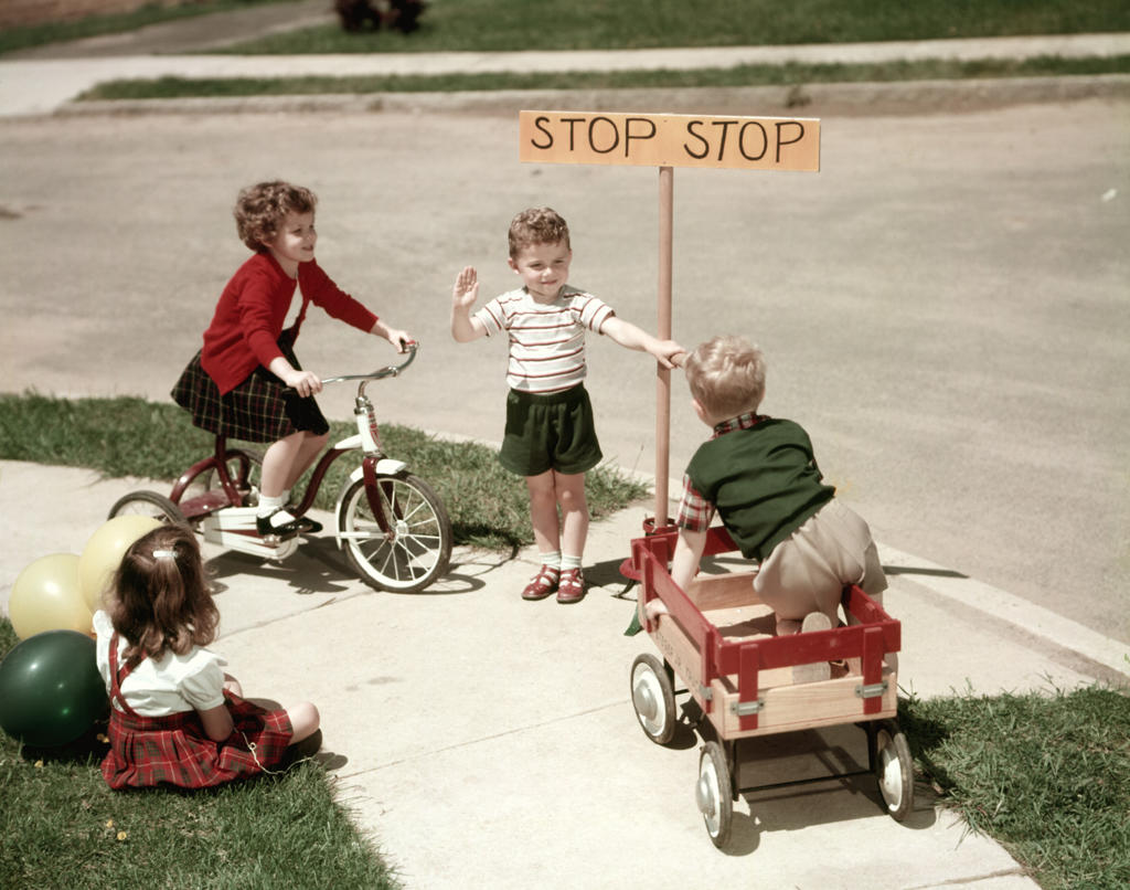 1950S Boys And Girls Outdoor With Tricycle And Wagon Playing Traffic With Police Stop Sign Americana
