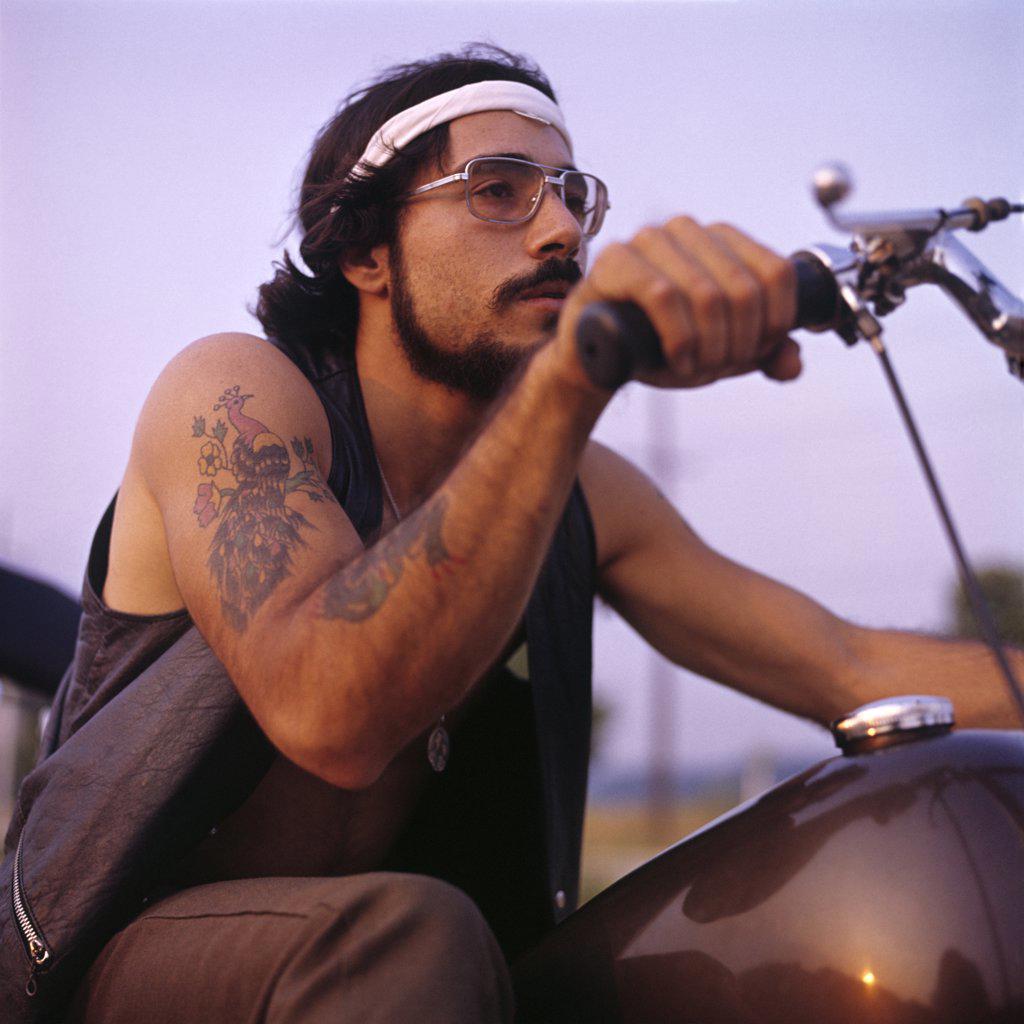 1970S Retro Man Motorcycle Easy Rider With Headband Tattoos Mustache Beard Wire Frame Glasses