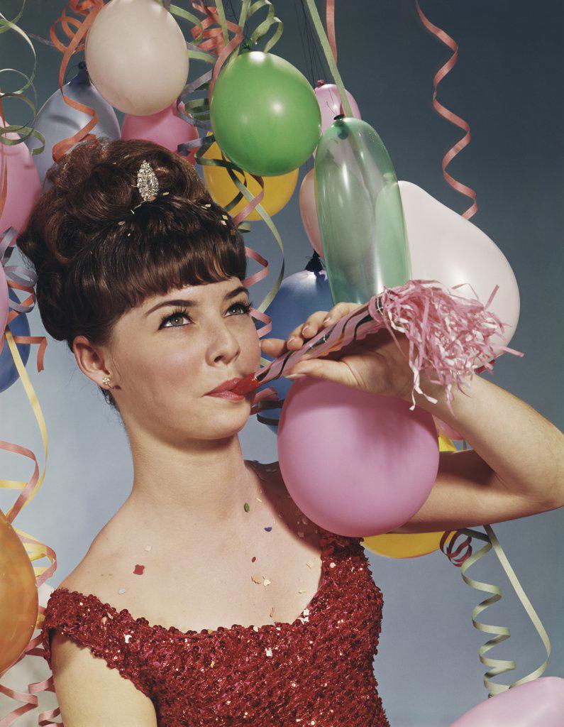 1960S Woman Blowing New Years Party Noisemaker  