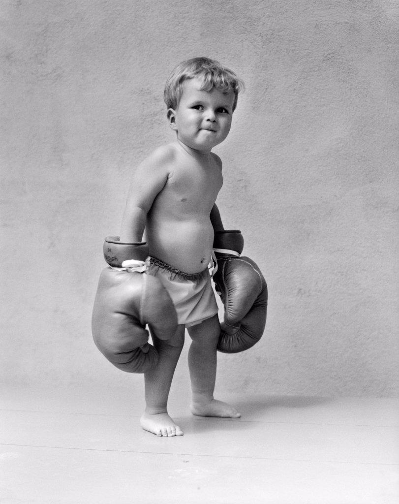 1930S Baby Boy Toddler Wearing Oversize Boxing Gloves