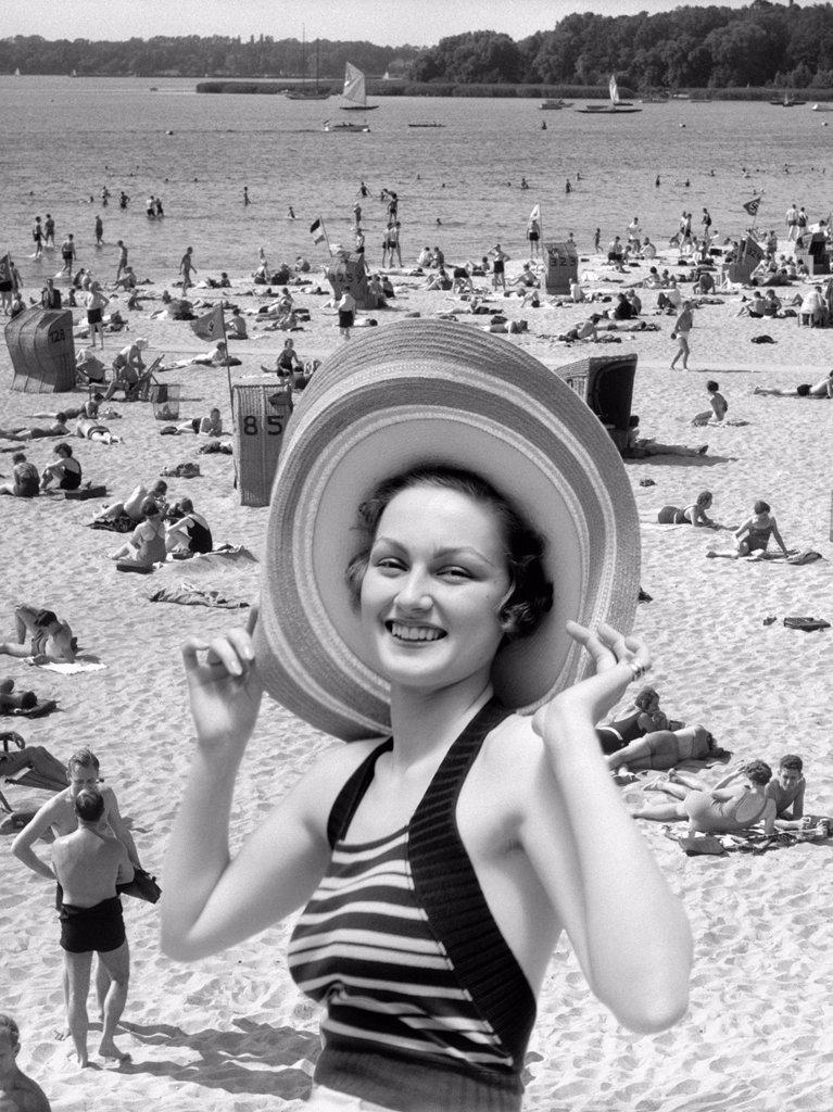 1930S Vacation Montage Portrait Smiling Woman In Bathing Suit Wearing Large Straw Hat And Scene Of Crowded Beach