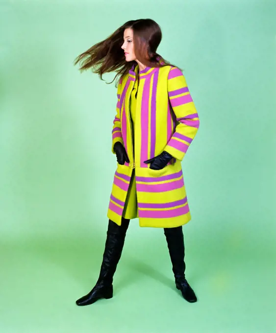 1960S Young Woman Wind Blown Hair Wear Green Purple Stripe Cloth Coat Thigh High Boots