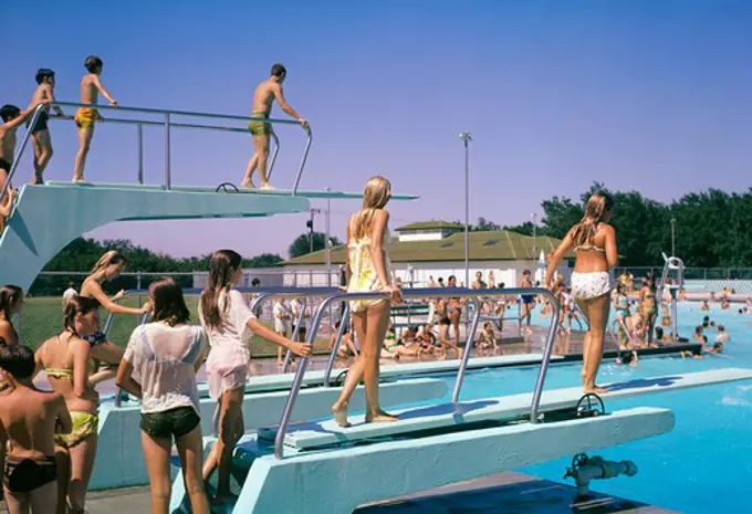1970S Crowd Of Teens In Pool & On Diving Board At Municipal Swim Pool Mcpherson Kansas Summer Fun Recreation Cool Wet