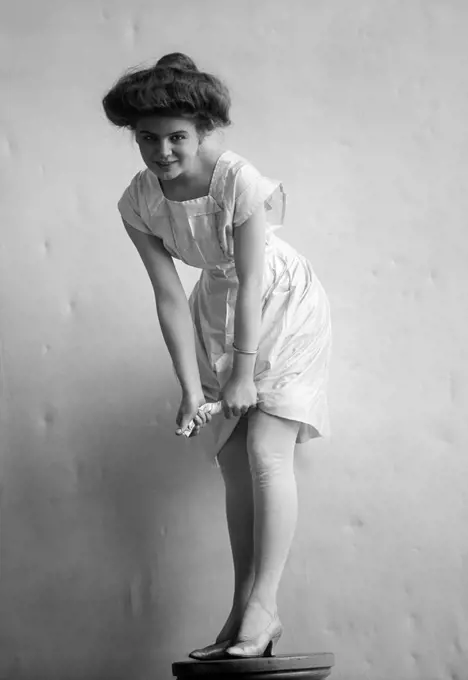 1900S 1910S Smiling Woman With Gibson Girl Hair Style Ringing Out Wet Chemise Hemline