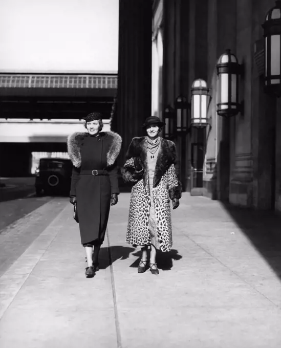 1930S Two Women Walking By 30Th Street Train Station One Wearing Coat With Fur Stole The Other Wearing Leopard Fur Coat Outdoor
