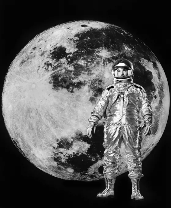1960S Man In Silver Astronaut Suit With Moon In Background