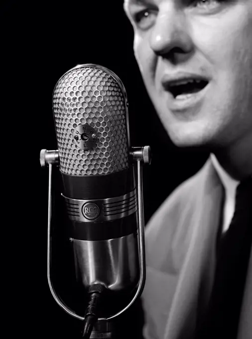 1950S Close-Up Of Man Announcer Talking Into Microphone Newscaster Indoor Symbolic Freedom Of Speech