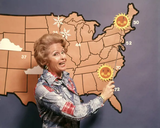 1960s 1970s DEMONSTRATIVE WOMAN TV FORECASTER GIVING WEATHER REPORT POINTING TO MAP LOOKING AT CAMERA