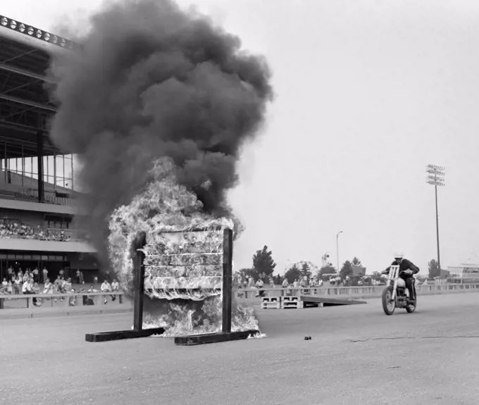 1960S Daredevil On Motorcycle Approaching Wall Of Fire