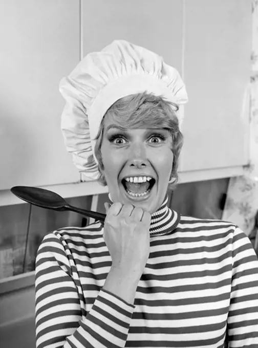 1970S Woman Portrait Wearing Chef'S Toque In Kitchen With Surprised Face
