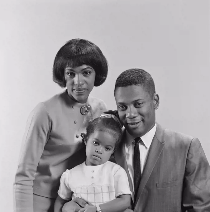 1960S African-American Family Portrait Father Mother Daughter Looking At Camera