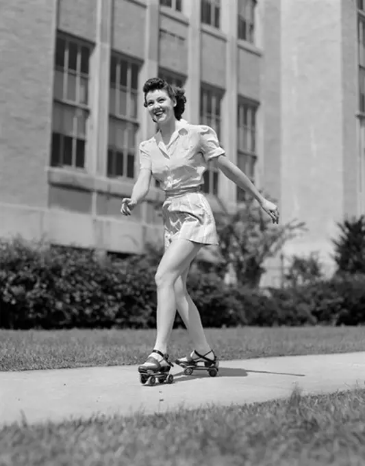 1940S Smiling Teen Girl On Roller Skates Skating On Sidewalk
