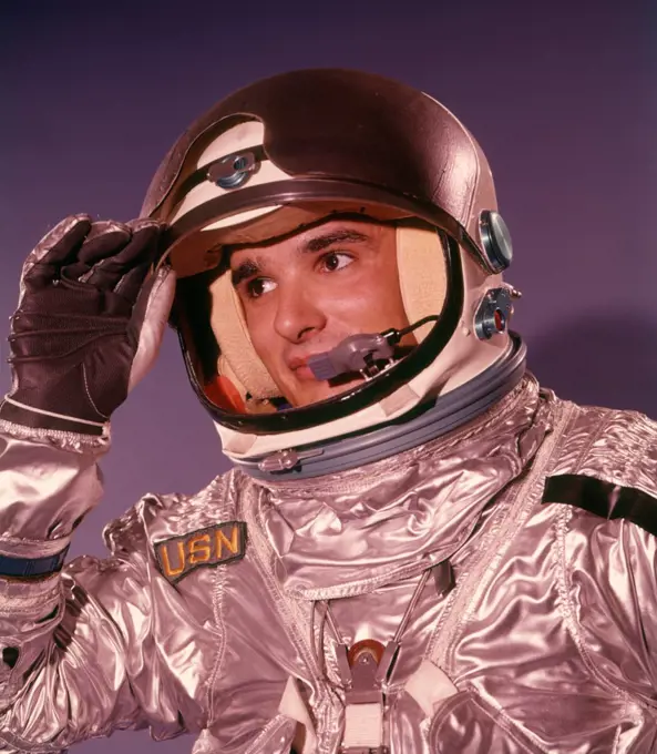 1960S Man Astronaut Lifting Up Visor Helmet Wearing Silver Navy Space Suit