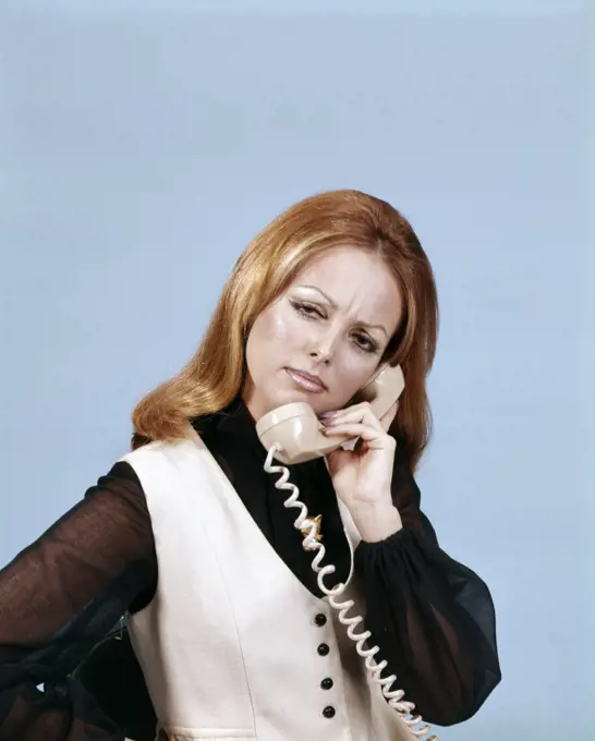 1970S Frowning Woman Talking On Telephone