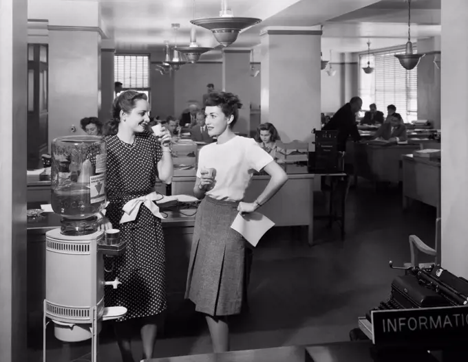 1940S Two Women Office Workers Standing By Office Water Cooler Talking