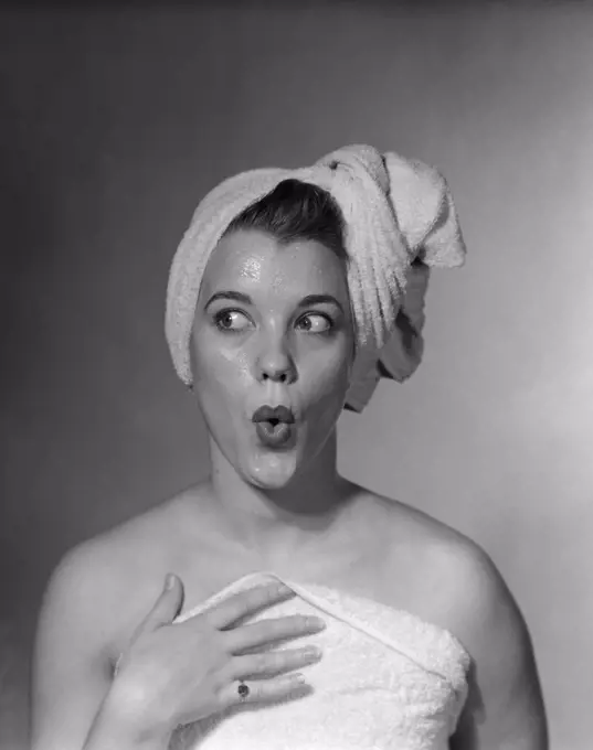 1950S Woman Making Funny Face Expression Wearing Towel On Head Looking Off To The Side