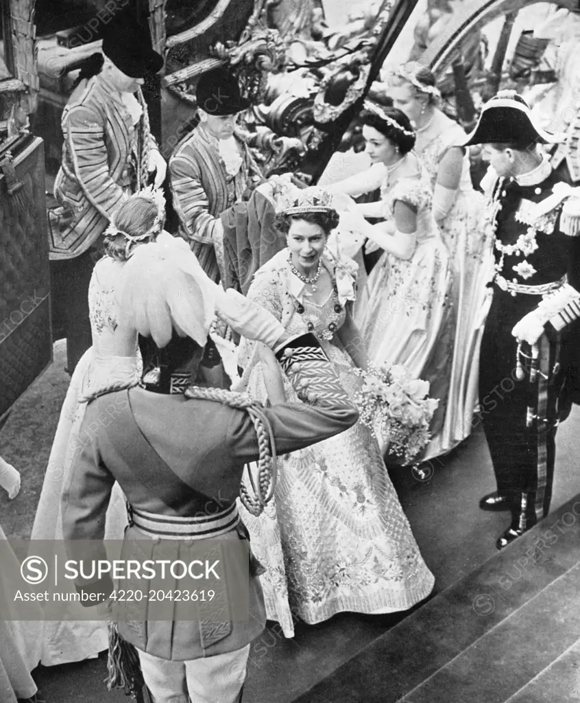 Queen Elizabeth II, accompanied by her Maids of Honour alights from the golden State Coach on arriving at Westminster Abbey for her Coronation in June 1953.  Prince Philip, Duke of Edinburgh awaits her.  The bouquet she carried included orchids, stephanotis and carnations from England, Scotland, Wales and Northern Ireland, and, by tradition, was presented to her by the Worshipful Company of Gardeners.     Date: 1953